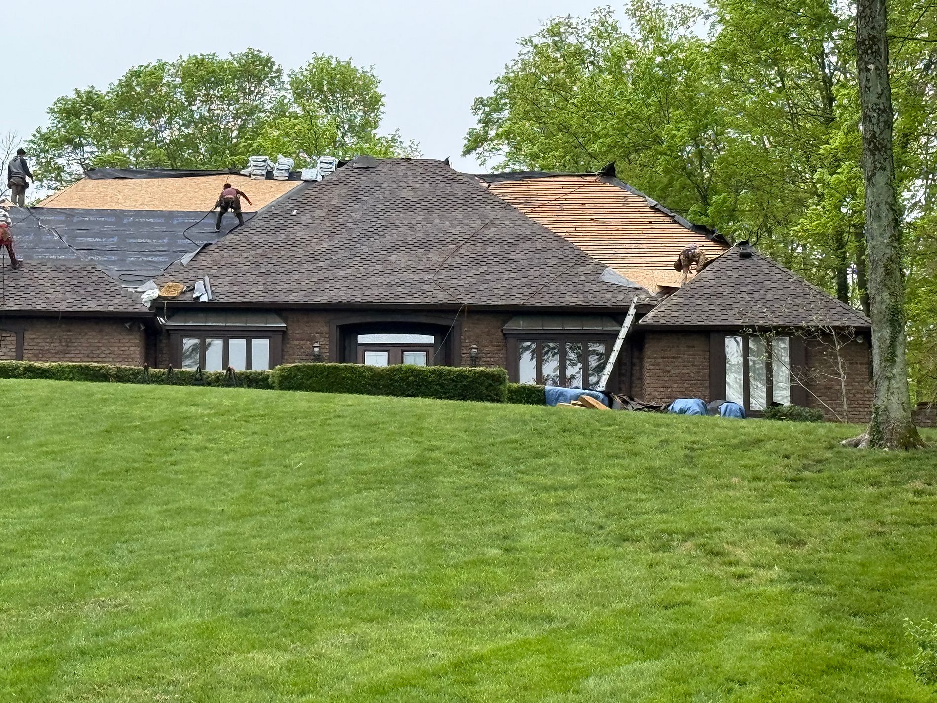 Parker Roofing crew installing a new roof on a Cincinnati-area home