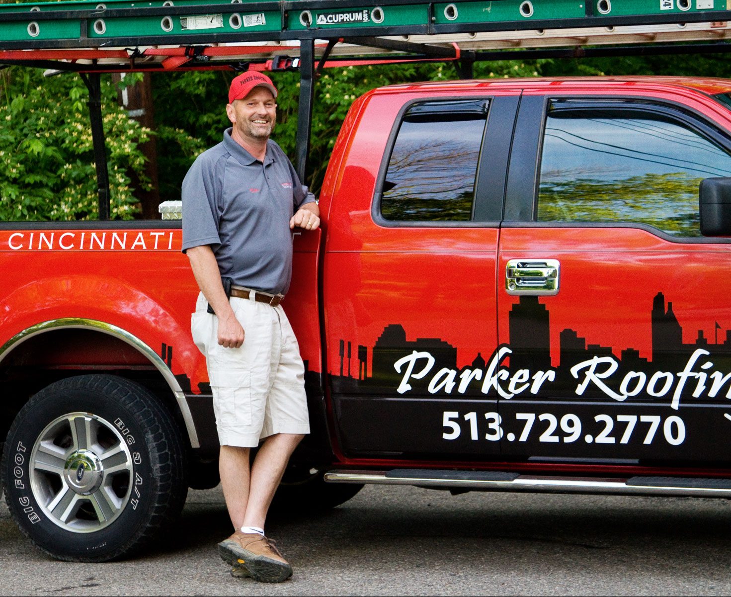 Mike Parker standing beside the Parker Roofing truck in Greater Cincinnati