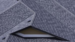 A view of newly build roof with grey tiles.